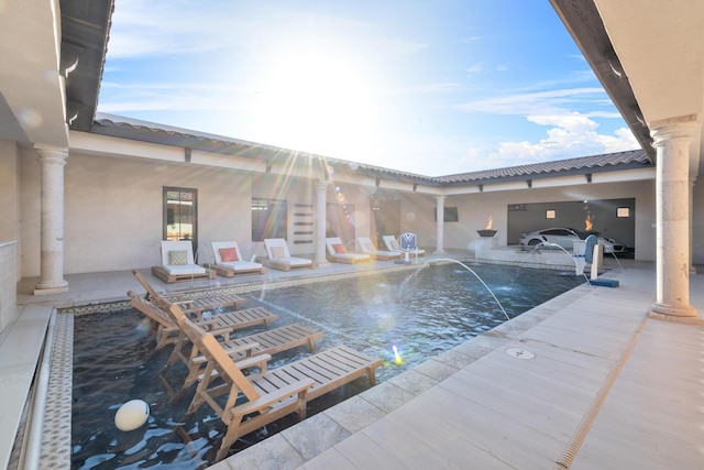 view of pool with pool water feature