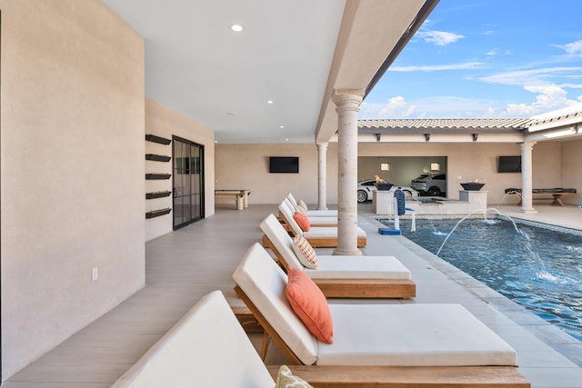 view of pool featuring a patio and pool water feature