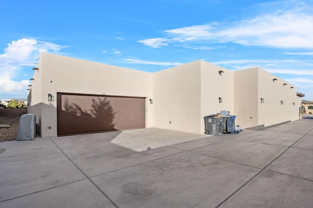 view of side of home with a garage