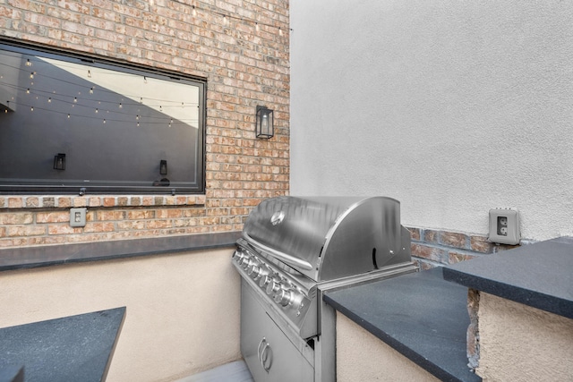 view of patio / terrace with an outdoor kitchen and area for grilling