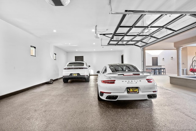 garage featuring a carport and a garage door opener