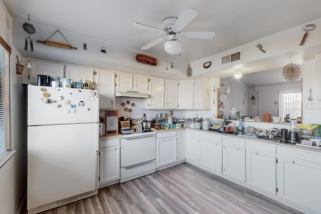 kitchen with sink, white appliances, light wood-type flooring, ceiling fan, and white cabinets