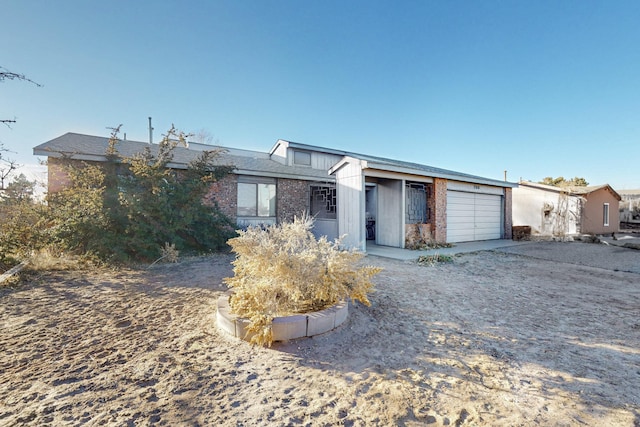 ranch-style home featuring a garage