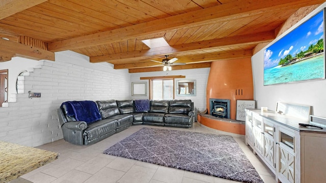 tiled living room with ceiling fan, wood ceiling, beamed ceiling, and brick wall