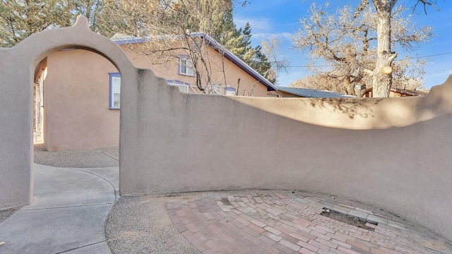 view of side of home with a patio area