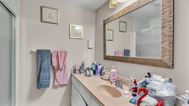 bathroom with vanity and an enclosed shower