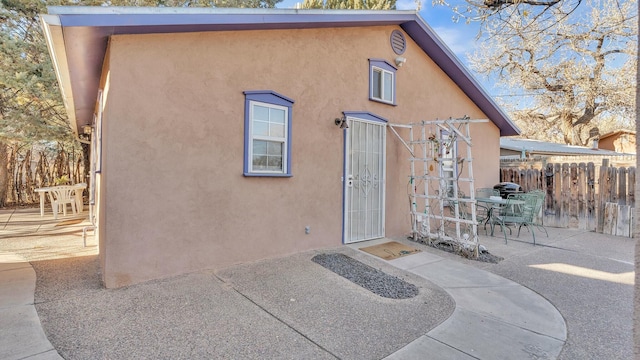 rear view of property with a patio area