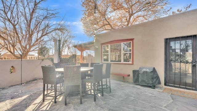 view of patio featuring a grill