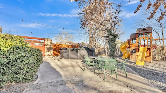 view of yard with a patio and a playground