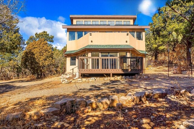 back of property featuring a sunroom