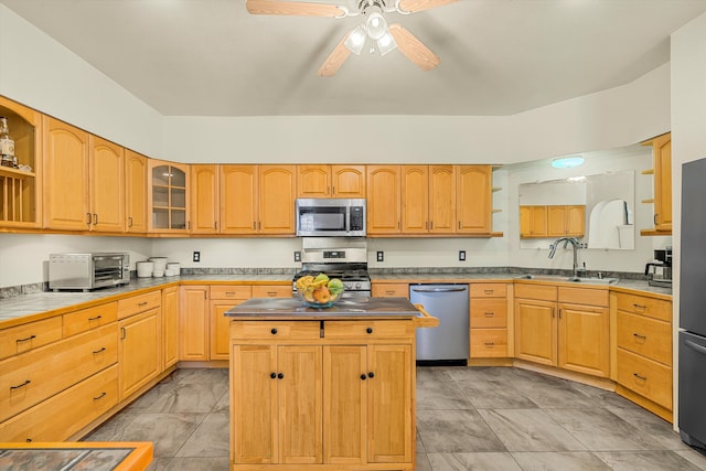 kitchen with a toaster, a kitchen island, a sink, appliances with stainless steel finishes, and open shelves