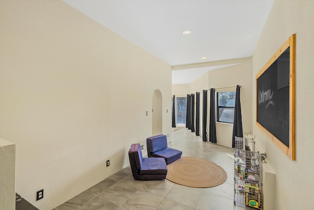 living area featuring arched walkways