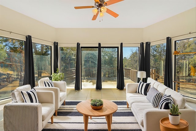 sunroom / solarium featuring ceiling fan