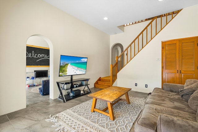 living room with stairway and recessed lighting