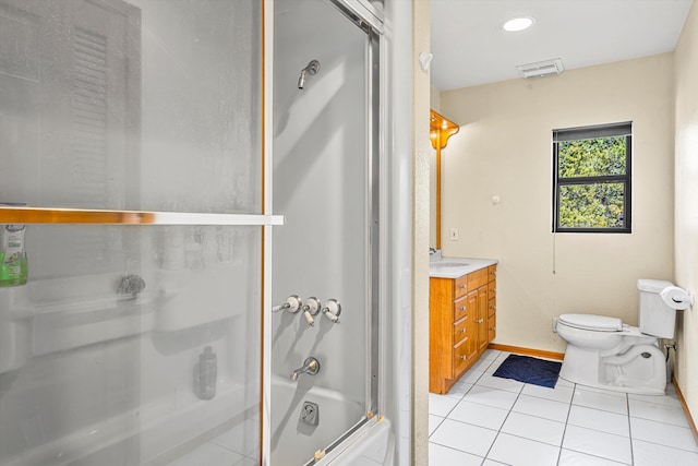 bathroom with visible vents, toilet, enclosed tub / shower combo, tile patterned flooring, and vanity