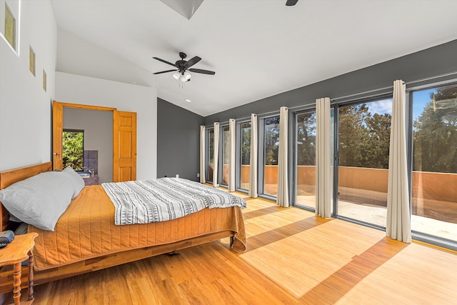 bedroom featuring lofted ceiling, visible vents, a ceiling fan, access to exterior, and light wood finished floors