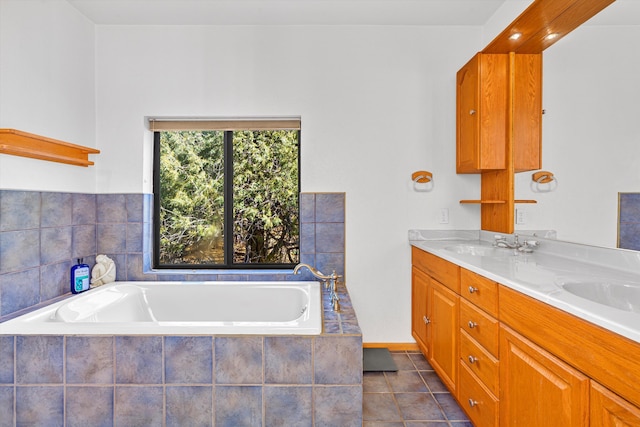 full bath featuring double vanity, tile patterned flooring, a sink, and a bath