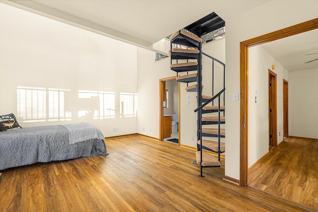 unfurnished bedroom featuring baseboards and wood finished floors