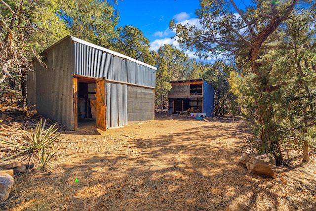 view of outbuilding featuring an outdoor structure