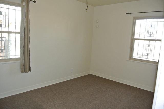 empty room with dark carpet