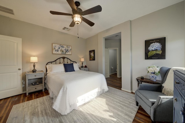 bedroom with dark wood-type flooring and ceiling fan