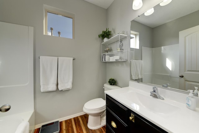 bathroom featuring hardwood / wood-style flooring, vanity, and toilet