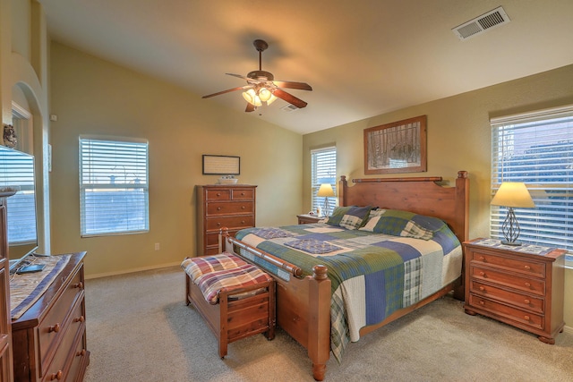 carpeted bedroom with ceiling fan and lofted ceiling