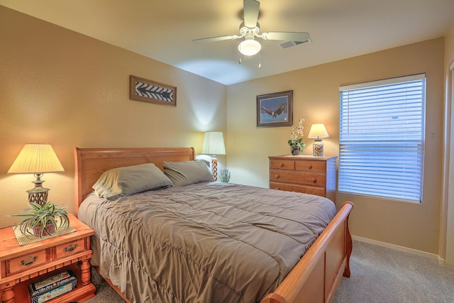 bedroom featuring ceiling fan and carpet