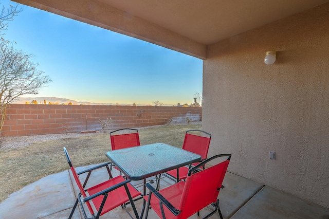 view of patio terrace at dusk