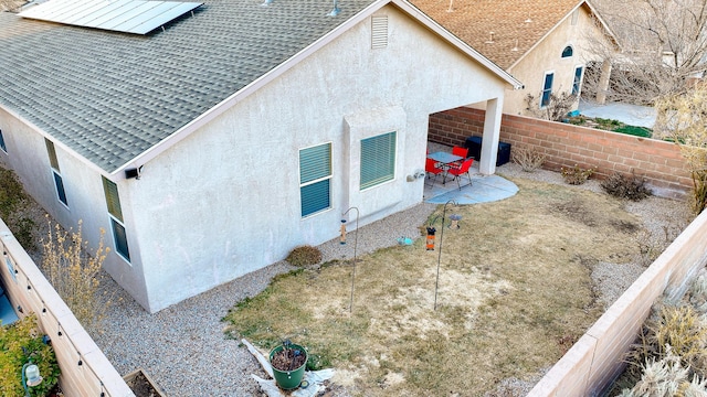 exterior space featuring a patio and solar panels