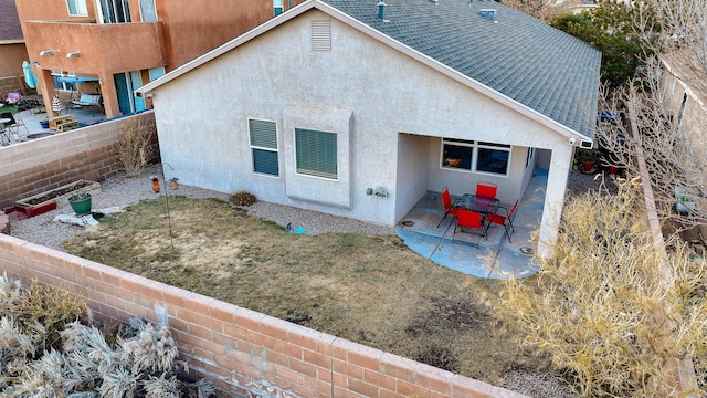 back of property featuring a patio area