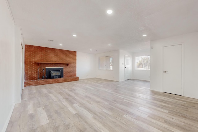 unfurnished living room with light hardwood / wood-style floors