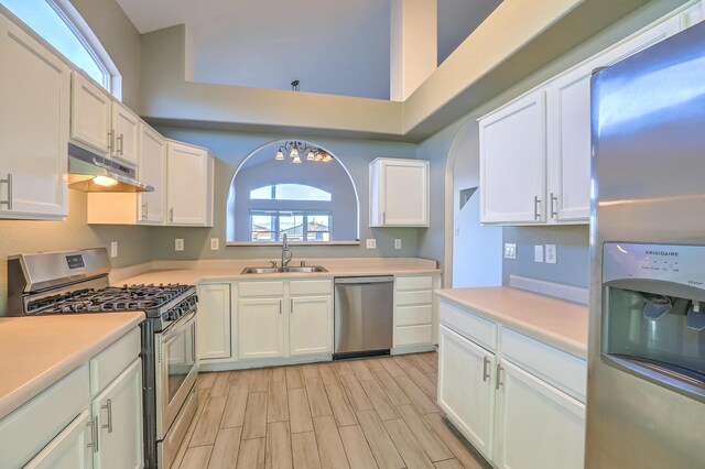 kitchen featuring sink, stainless steel appliances, and white cabinets