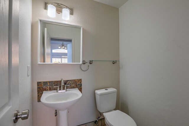 bathroom with sink and toilet