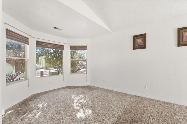 unfurnished living room featuring ceiling fan, vaulted ceiling, built in features, and light tile patterned floors