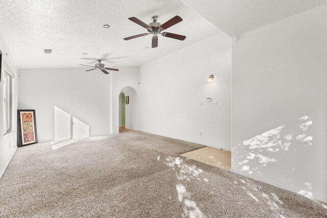 unfurnished room featuring vaulted ceiling, ceiling fan, and light tile patterned flooring