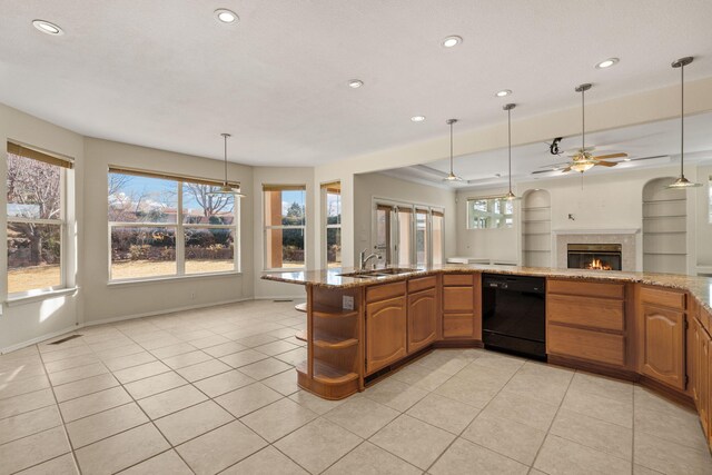 kitchen with a warm lit fireplace, a sink, black dishwasher, open floor plan, and open shelves