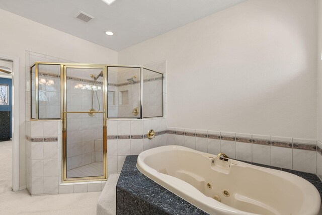 bathroom with a whirlpool tub and a stall shower