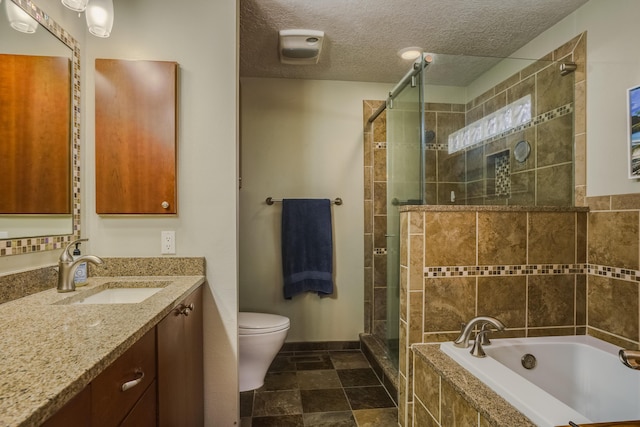 full bathroom with vanity, toilet, separate shower and tub, and a textured ceiling