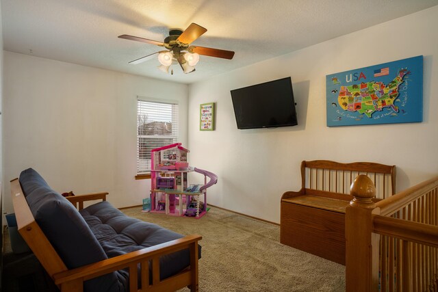 carpeted bedroom featuring a textured ceiling and ceiling fan