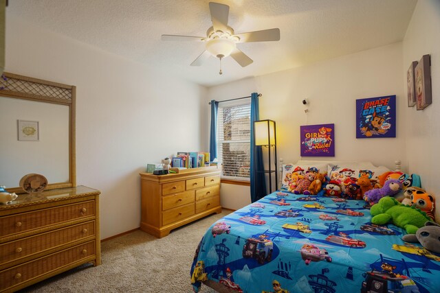 carpeted bedroom featuring a textured ceiling and ceiling fan