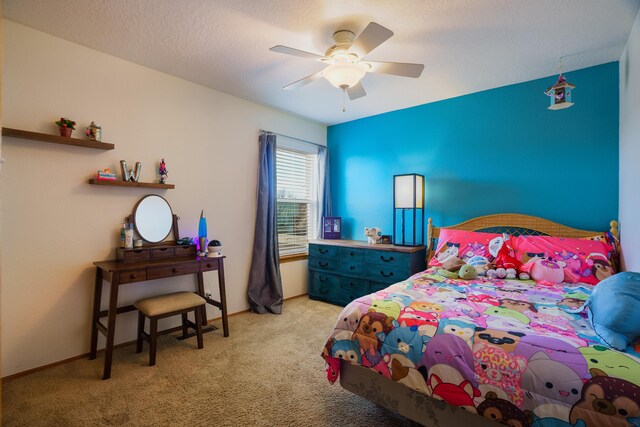 carpeted bedroom featuring a textured ceiling and ceiling fan