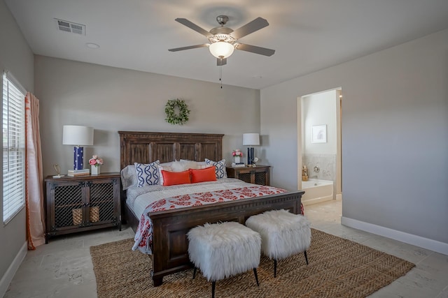 bedroom with ceiling fan and ensuite bath