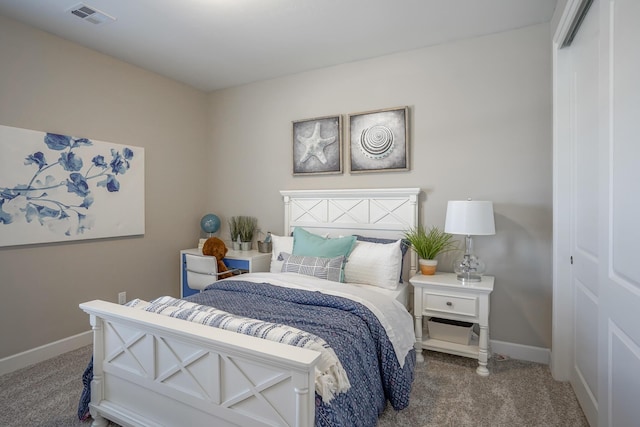 bedroom with carpet floors and a closet