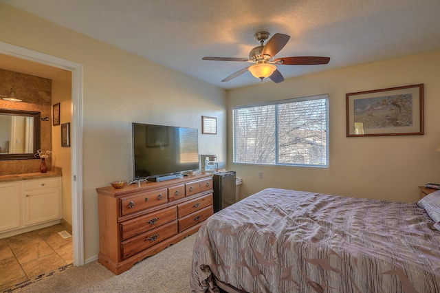 bedroom with ceiling fan and ensuite bathroom