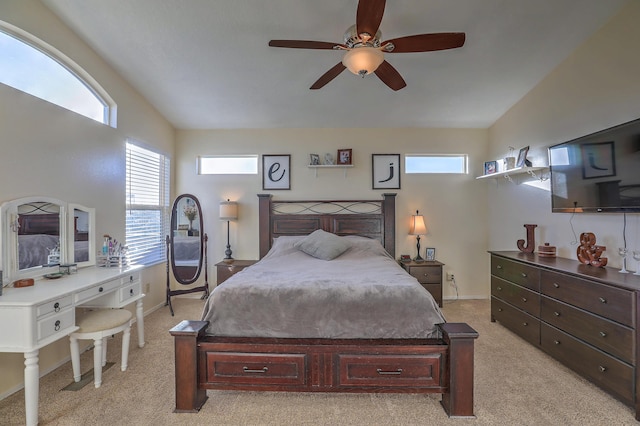 carpeted bedroom featuring ceiling fan and vaulted ceiling