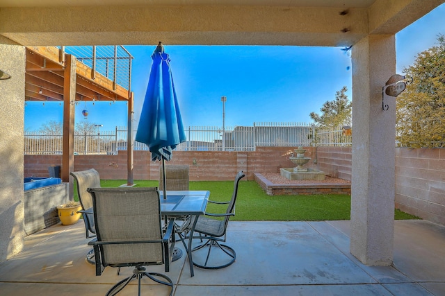 view of patio with a water view