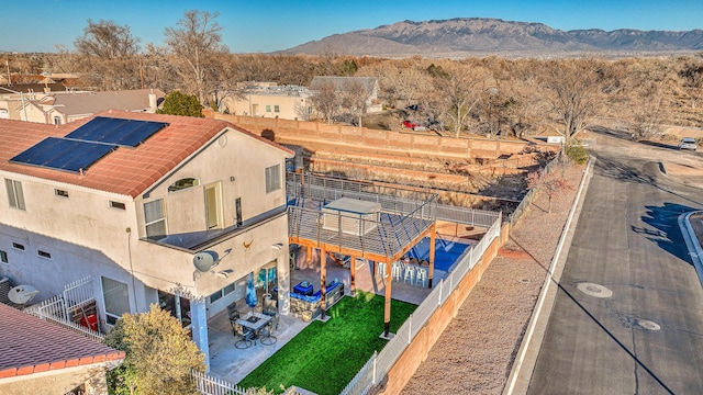 birds eye view of property featuring a mountain view