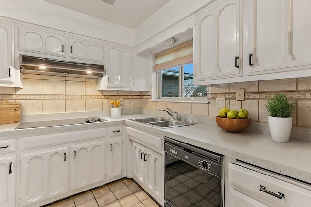 kitchen featuring white cabinetry, sink, backsplash, and black appliances