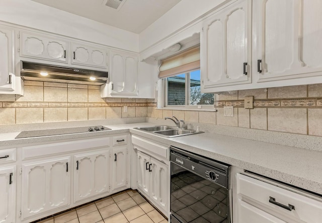 kitchen featuring white cabinetry, sink, tasteful backsplash, and black appliances